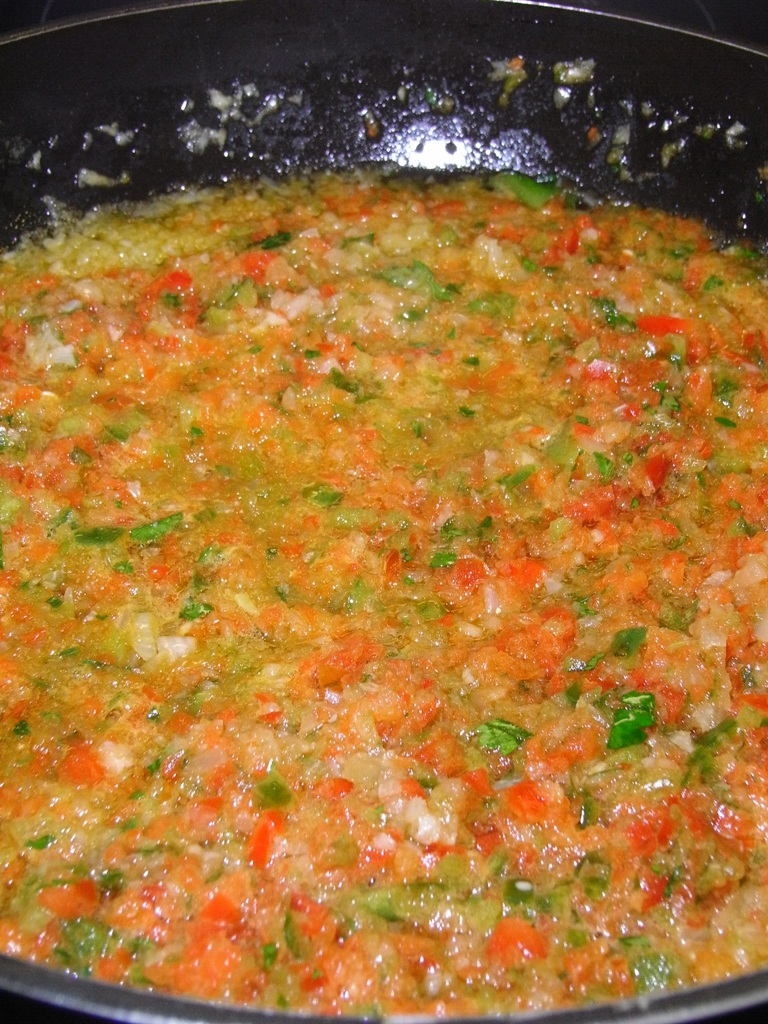 blended, minced vegetables in a bowl, predominant colors orange, yellow and green